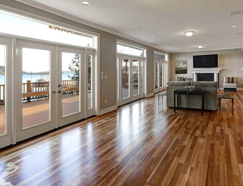homeguide-spacious-living-room-with-hardwood-flooring-and-glass-doors